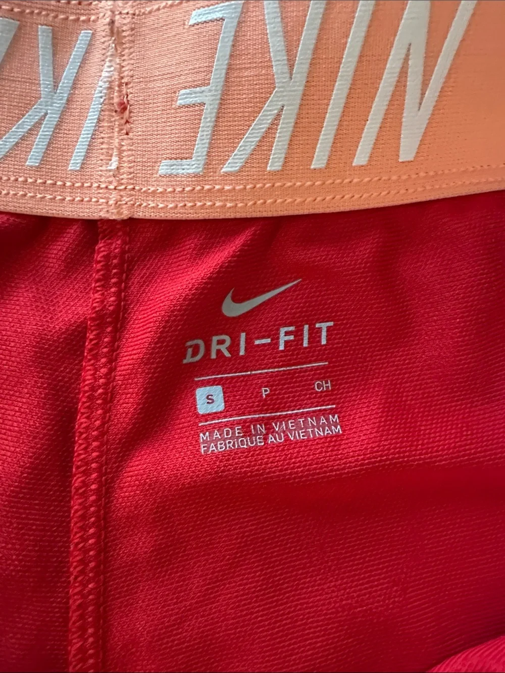 Nike Red Women's Athletic Running Shorts with peach Swoosh